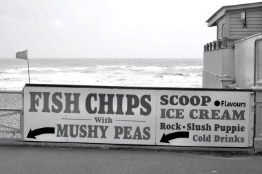 Brighton, East Sussex, England, July 05 2021: Despite the stormy, windy weather tourist flock to Brighton attracted by the spectacular waves, great range of take away food and holiday atmosphere