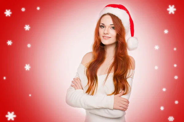 Casual seksi redhead kadın Santa şapka giymiş.