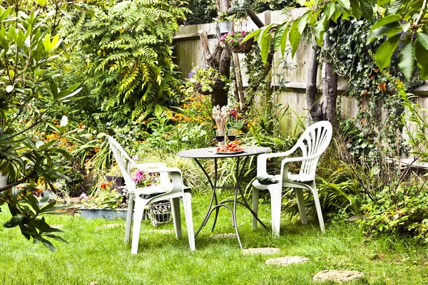 Lush cottage garden on a summer day Stock Picture