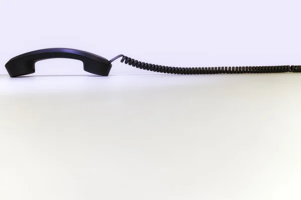 Un ricevitore telefonico nero per affari sdraiato — Foto Stock