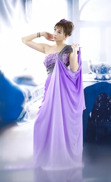 Beautiful bride in purple dress — Stock Photo, Image