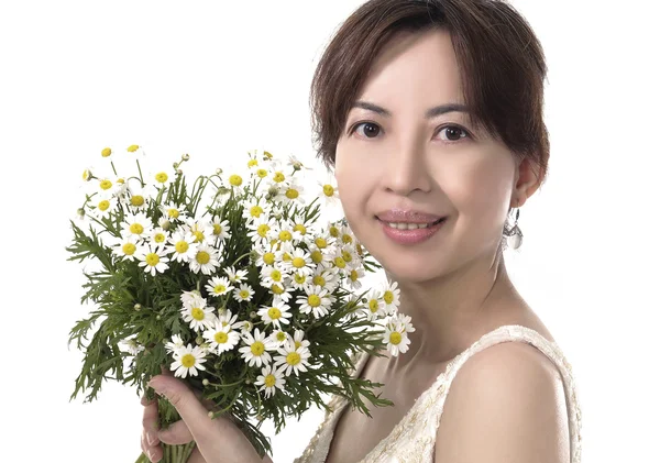 Beautiful bride with huge bouquet of flowers — Stock Photo, Image