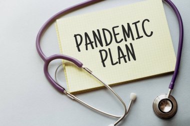 Mor arkaplanda sarı listeli bir steteskop ve metin PANDEMIC Planı