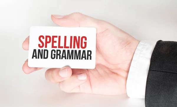 Businessman Holding Card Text Spelling Grammar — Stock Photo, Image