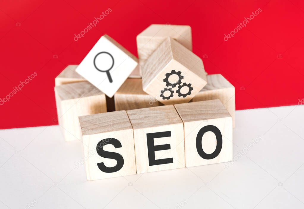 Seo concept. Wooden cubes on red. Search Engine Optimization.