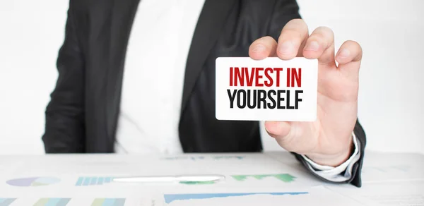 Business Man Holding Card Text Invest Yourself — стоковое фото