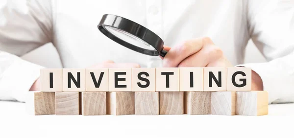 Businessman Holding Magnifier Businessman Watch Wooden Cubes Text Investing Financial — Stock Photo, Image