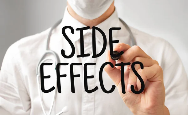 Doctor writing word SIDE EFFECTS with marker, Medical concept