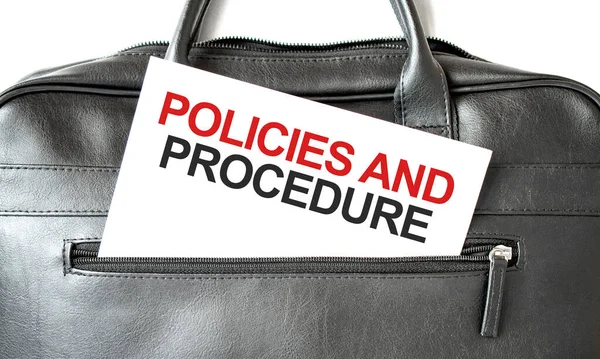 Text Policies and Procedure writing on white paper sheet in the black business bag. Business concept