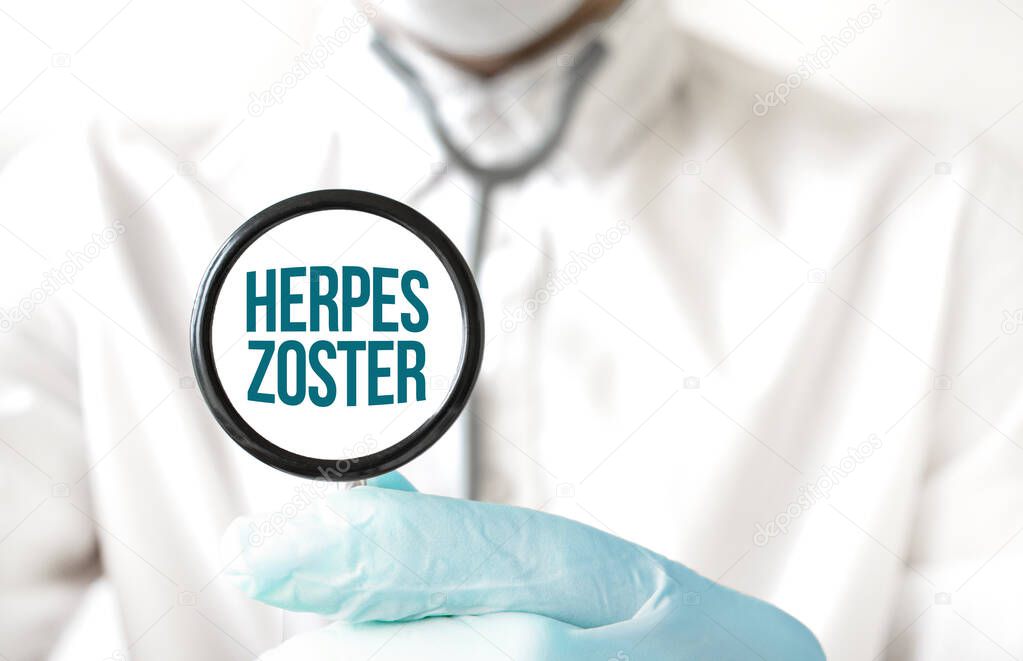 Doctor holding a stethoscope with text HERPES ZOSTER, medical concept