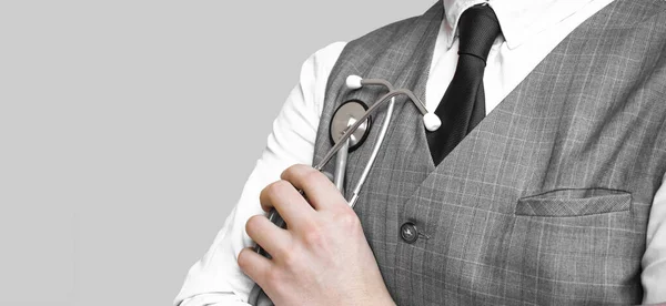 Doctor Suit Holding Grey Stethoscope Grey Background — Stock Photo, Image