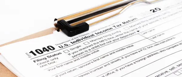 Tax form 1040 for tax year 2012 for US individual tax return with pen