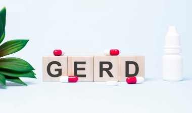 GERD. Text abbreviation on wood cubes blocks on light blue background. Most commonly diagnosed mental disorder of children. Close up. clipart
