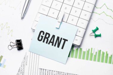Mesaj Grant. Kağıt deftere yazılmış kelimeler. İş yeri. İş konsepti.