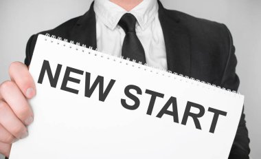 Businessman holding a card with text