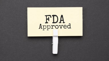 FDA kağıt üzerinde wihte şarjörlü metni onayladı. Siyah arkaplanda