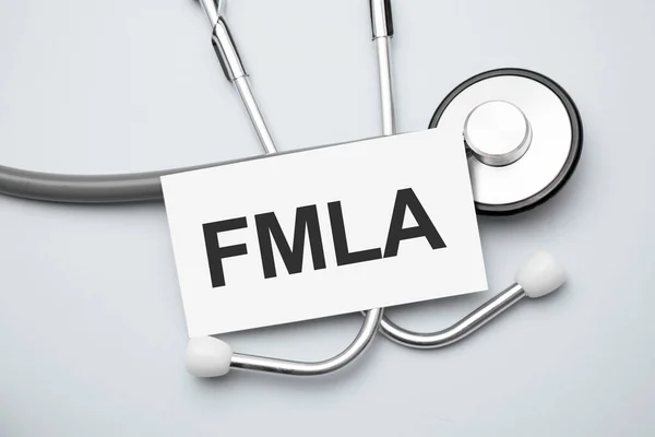 Carta Con Family Medical Leave Act Fmla Tavolo Stetoscopio Grigio — Foto Stock