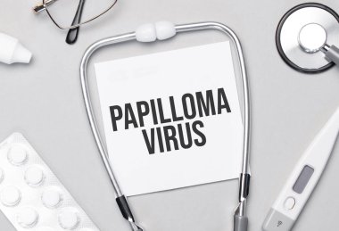 Defterde Papilloma virüsü steteskobu, haplar ve gözlükler var..