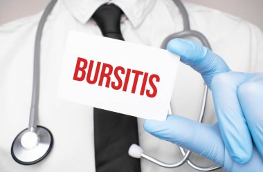 Doctor holding a card with text Bursitis medical concept