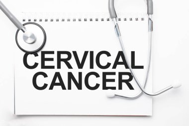 Gri steteskop ve kağıttan bir sayfa beyaz kağıt servikal kanser açık mavi arka plan. Tıbbi konsept.