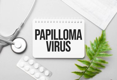 Papilloma virüsü kelime not defteri, steteskop ve yeşil bitki