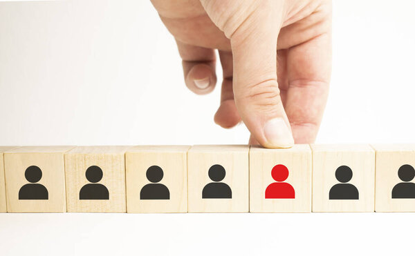 Human resources management and recruitment business build team concept. Wooden cube block on top with icon