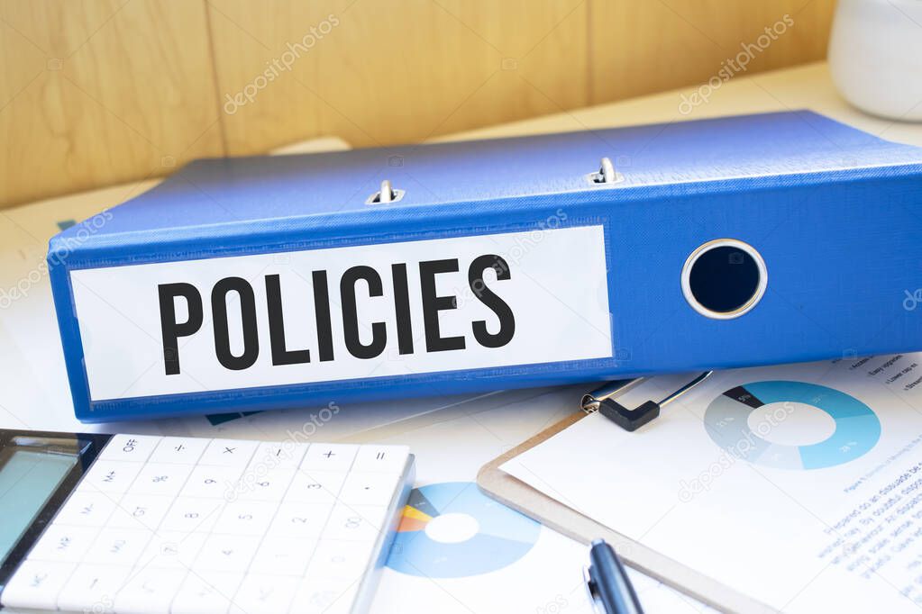 policies words on labels with document binders