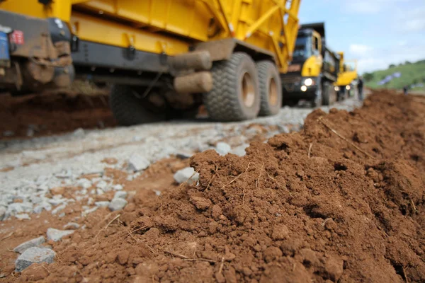 Tipper trucks moving earth — Stock Image Tipper trucks moving earth Stock Image