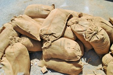 Sandbags lying on the ground clipart