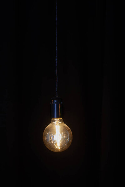 old vintage electric lamp on black background