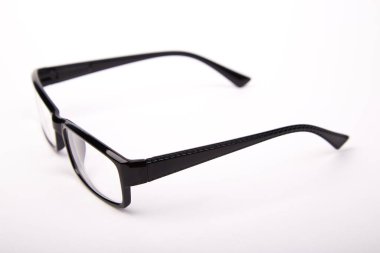 Stylish glasses with black frames on a white background