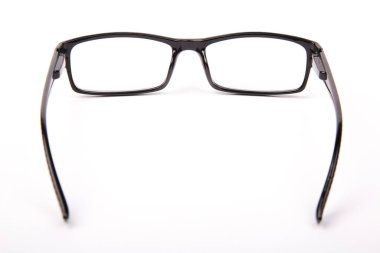 Stylish glasses with black frames on a white background