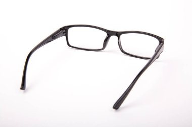 Stylish glasses with black frames on a white background