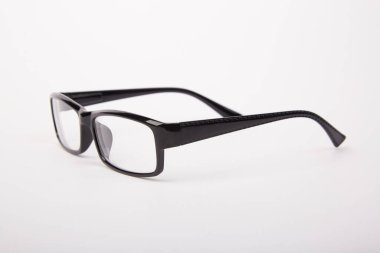 Stylish glasses with black frames on a white background