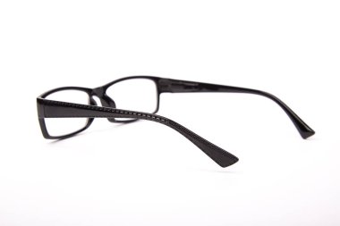 Stylish glasses with black frames on a white background
