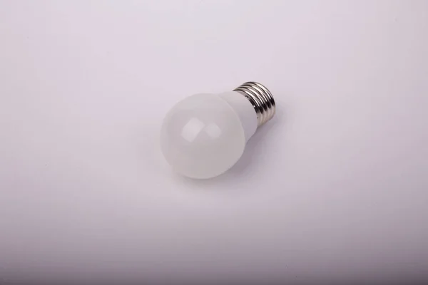 Matte Energy Saving Light Bulb Light Gray Background — Foto Stock