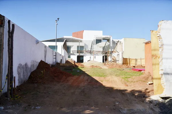 Construction site, in panoramic view with construction and renovation of a house in an urban area in the background metallic structure and building in an urban area in Brazil, South America