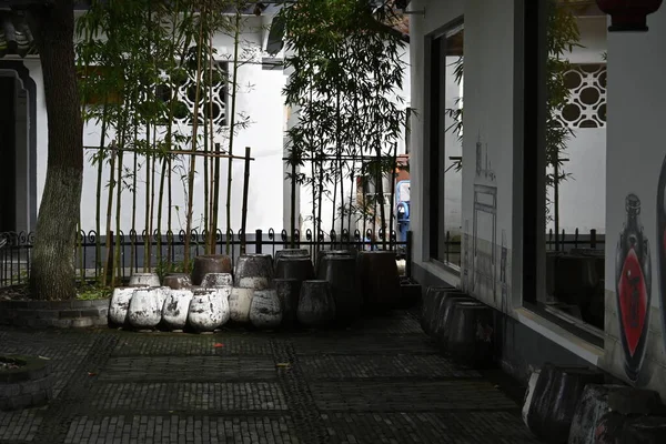 The shaded courtyard of a local rice wine merchant\'s store - in Jinze Town