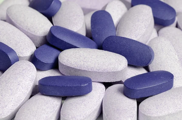 Modré a bílé pilulky podrobnějšího zobrazení — Stock fotografie