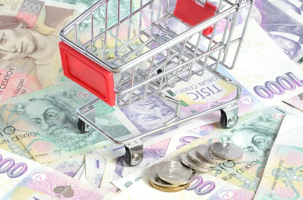 Shopping cart and czech banknotes, coins texture background — Stock Photo, Image
