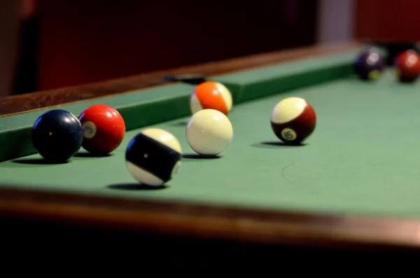 Pool table with pool balls and cue ball — Stock Photo, Image
