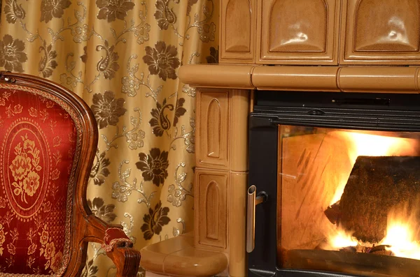 Old ancient chair and fireplace — Stock Photo, Image