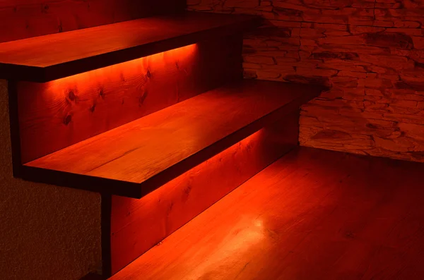 Illuminated wooden stairs — Stock Photo, Image