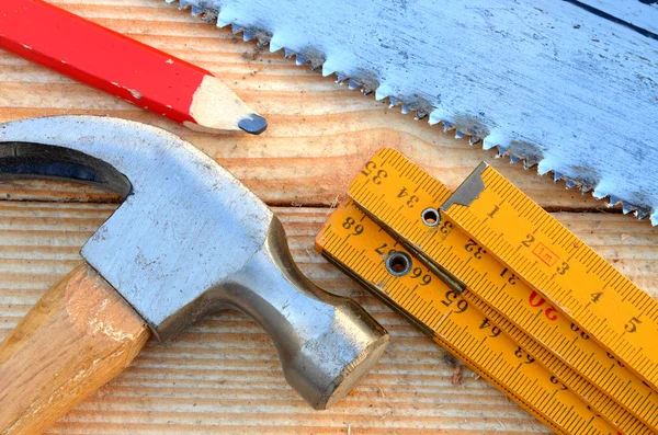 Handsaw, claw hammer, carpenter meter, pencil — Stock Photo, Image