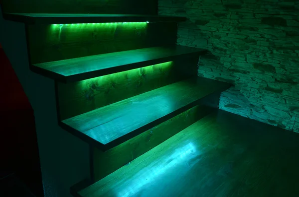 Illuminated wooden stairs — Stock Photo, Image