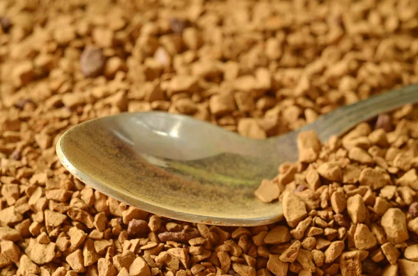 Spoon in light brown powder of instant coffee — Stock Photo, Image