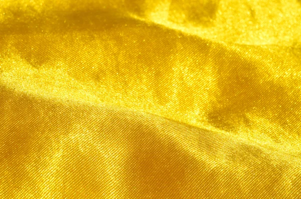 Close-up detail of gold satin — Stock Photo, Image