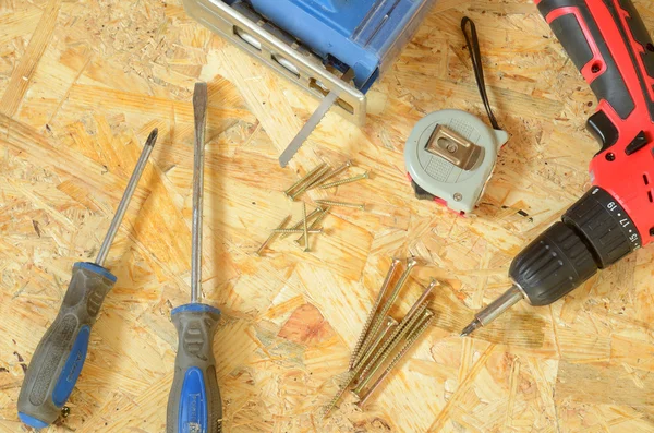Set of tools - jigsaw, drill, pliers, screws, screwdriver — Stock Photo, Image