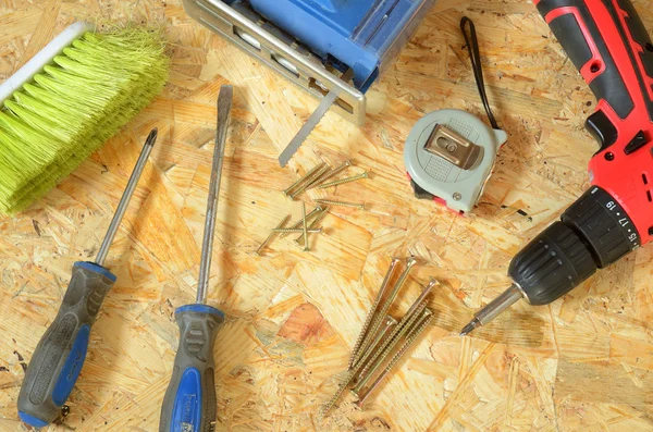 Set of tools - jigsaw, drill, pliers, screws, screwdriver — Stock Photo, Image