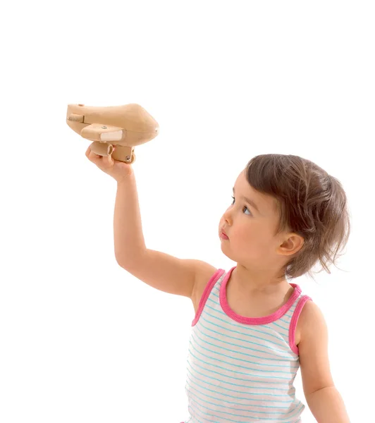 Criança bonita brincando com um avião de brinquedo. Isolado sobre fundo branco — Fotografia de Stock